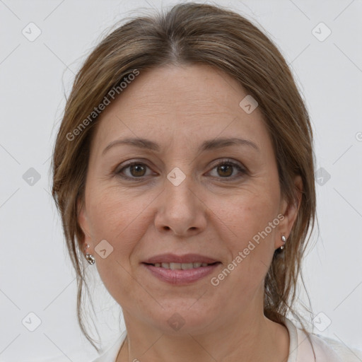 Joyful white adult female with medium  brown hair and brown eyes