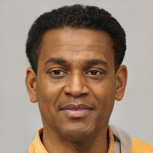 Joyful latino adult male with short  brown hair and brown eyes