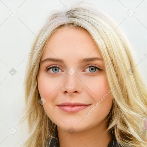 Joyful white young-adult female with long  brown hair and blue eyes