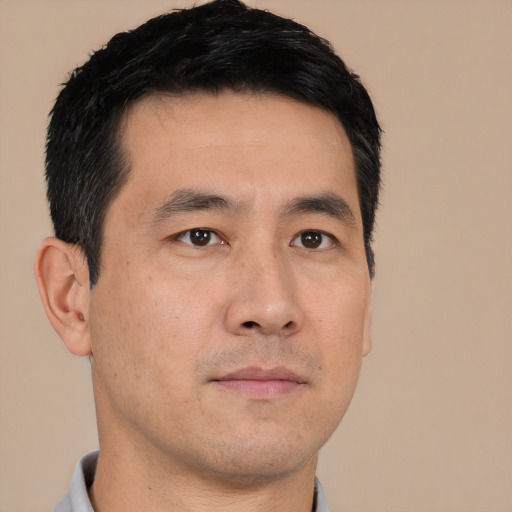 Neutral asian young-adult male with short  black hair and brown eyes