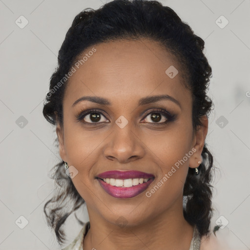Joyful black young-adult female with medium  black hair and brown eyes