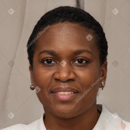 Joyful black young-adult female with short  black hair and brown eyes