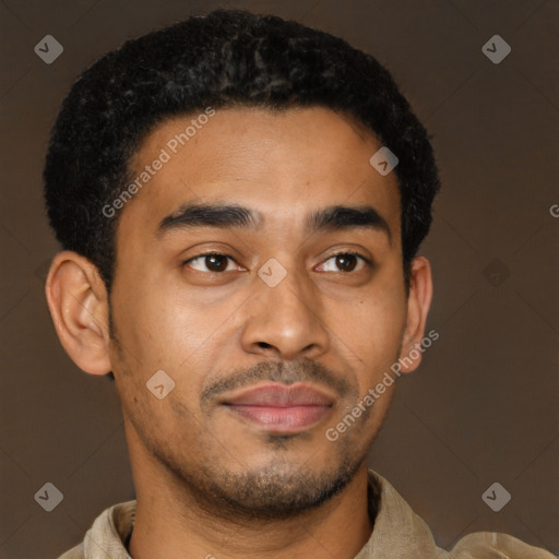 Joyful latino young-adult male with short  brown hair and brown eyes