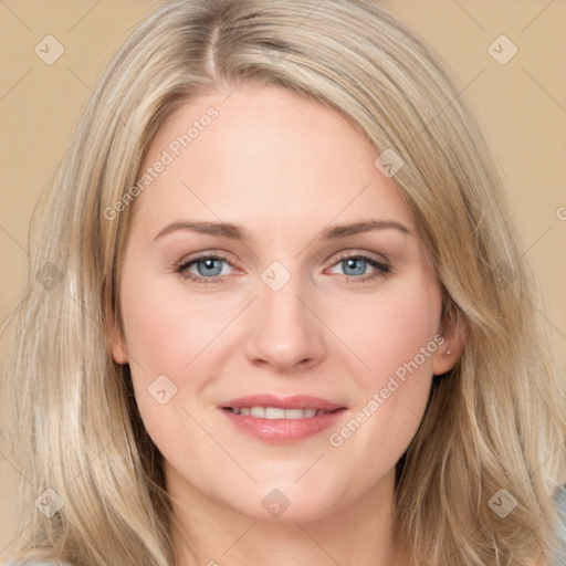 Joyful white young-adult female with long  brown hair and blue eyes