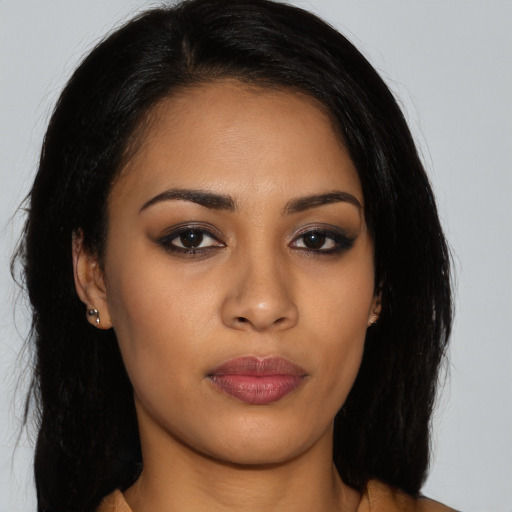 Neutral latino young-adult female with long  brown hair and brown eyes