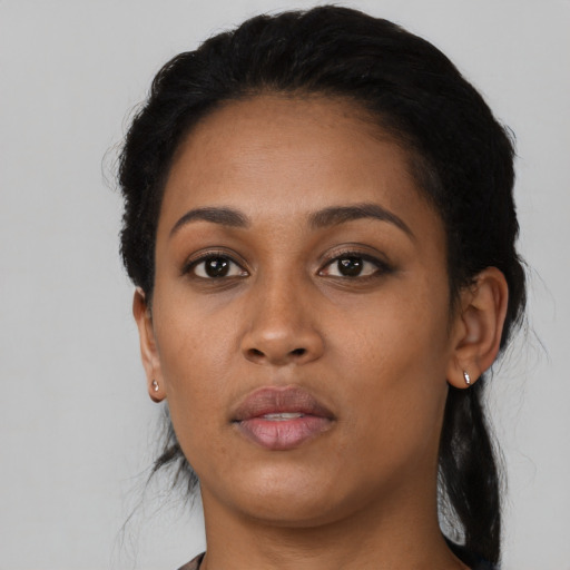 Neutral black young-adult female with long  black hair and brown eyes