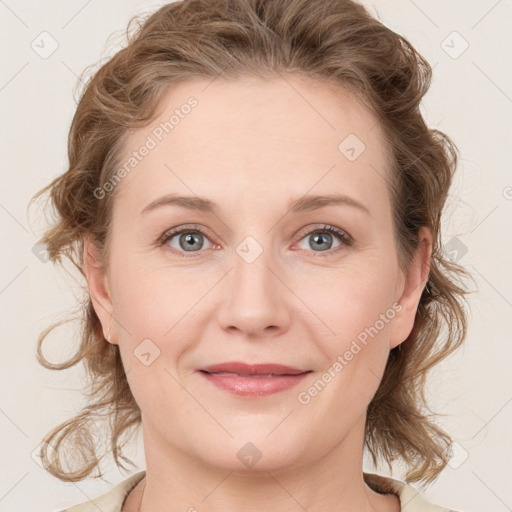 Joyful white young-adult female with medium  brown hair and blue eyes