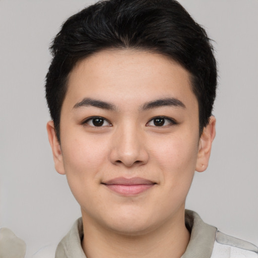 Joyful asian young-adult female with short  brown hair and brown eyes