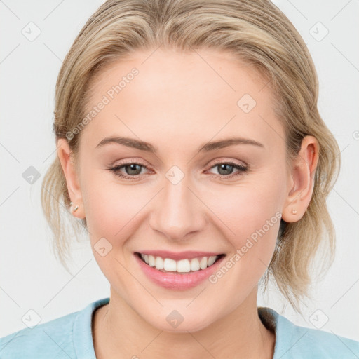 Joyful white young-adult female with medium  brown hair and blue eyes