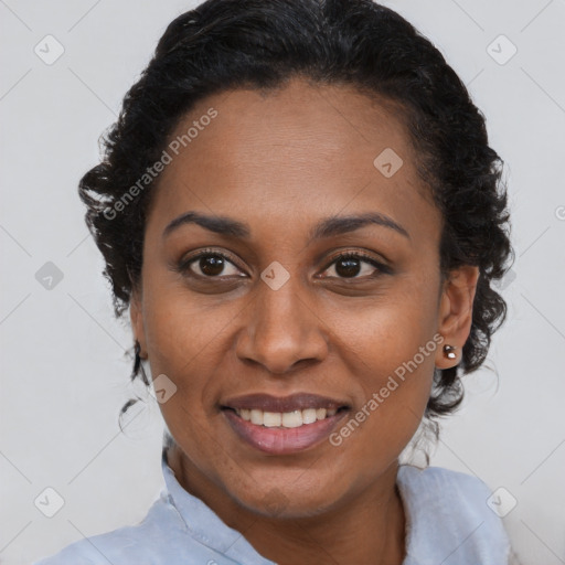 Joyful black adult female with short  brown hair and brown eyes