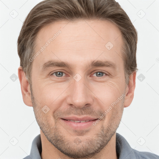 Joyful white adult male with short  brown hair and grey eyes