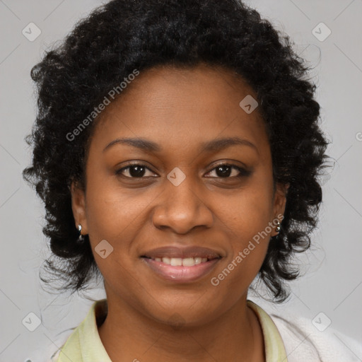 Joyful black young-adult female with long  brown hair and brown eyes