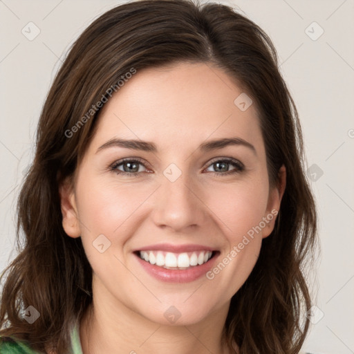 Joyful white young-adult female with medium  brown hair and green eyes