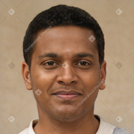 Joyful latino young-adult male with short  brown hair and brown eyes