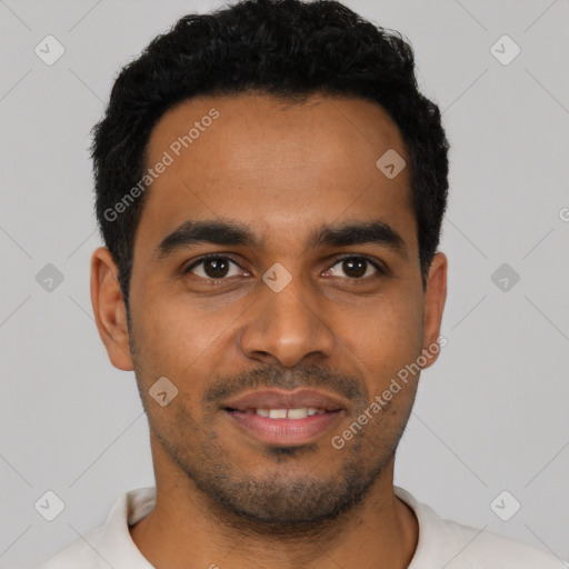 Joyful latino young-adult male with short  black hair and brown eyes