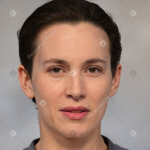 Joyful white adult female with short  brown hair and brown eyes