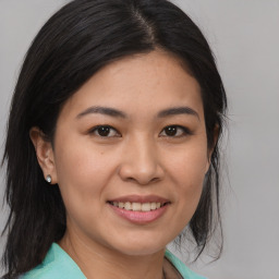 Joyful asian young-adult female with medium  brown hair and brown eyes