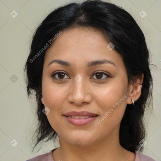 Joyful latino young-adult female with medium  brown hair and brown eyes