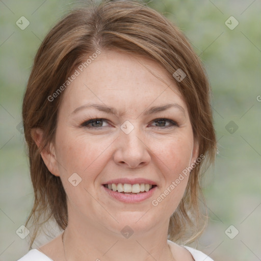 Joyful white adult female with medium  brown hair and brown eyes