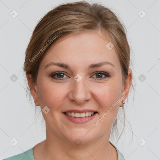 Joyful white young-adult female with medium  brown hair and grey eyes