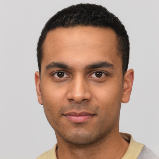 Neutral latino young-adult male with short  black hair and brown eyes
