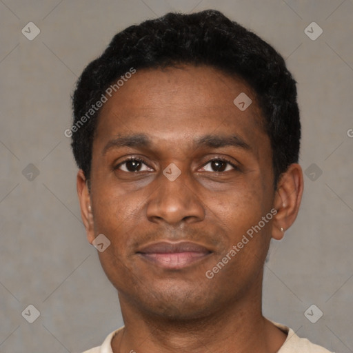 Joyful black young-adult male with short  black hair and brown eyes