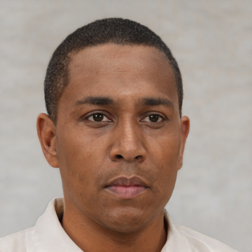 Neutral latino young-adult male with short  brown hair and brown eyes