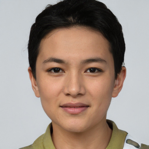 Joyful asian young-adult female with short  black hair and brown eyes