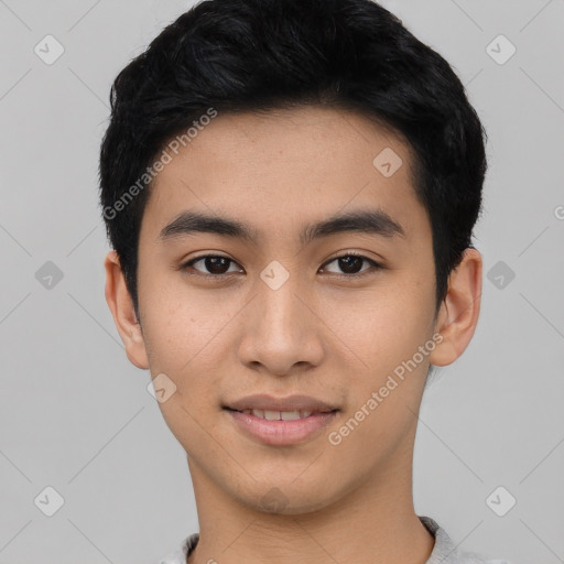 Joyful asian young-adult male with short  black hair and brown eyes