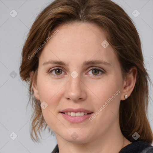 Joyful white adult female with medium  brown hair and grey eyes