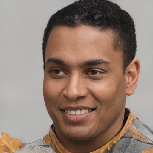 Joyful latino young-adult male with short  brown hair and brown eyes