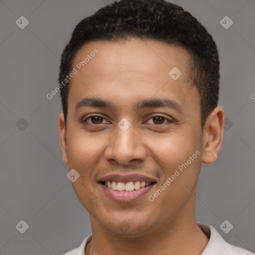 Joyful latino young-adult male with short  black hair and brown eyes