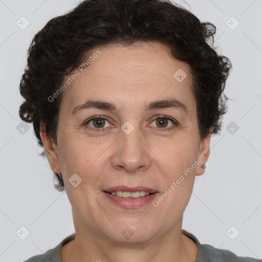 Joyful white adult female with short  brown hair and brown eyes