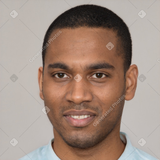 Joyful black young-adult male with short  black hair and brown eyes