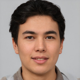 Joyful asian young-adult male with short  brown hair and brown eyes