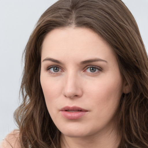 Neutral white young-adult female with long  brown hair and grey eyes