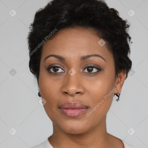 Joyful black young-adult female with short  brown hair and brown eyes