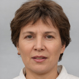 Joyful white adult female with short  brown hair and brown eyes