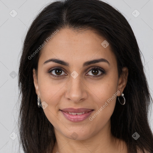 Joyful latino young-adult female with long  brown hair and brown eyes