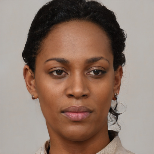 Neutral black young-adult female with short  black hair and brown eyes