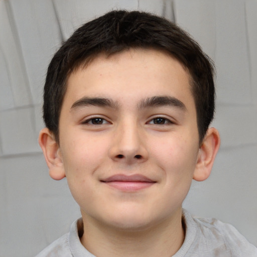 Joyful white child male with short  brown hair and brown eyes