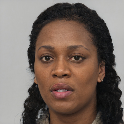 Neutral black adult female with long  black hair and brown eyes