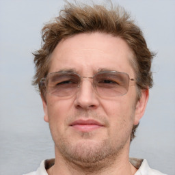 Neutral white middle-aged male with short  brown hair and brown eyes