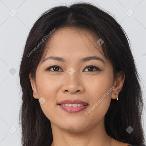 Joyful asian young-adult female with long  brown hair and brown eyes