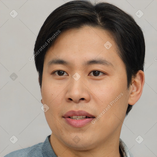 Joyful asian young-adult male with short  brown hair and brown eyes