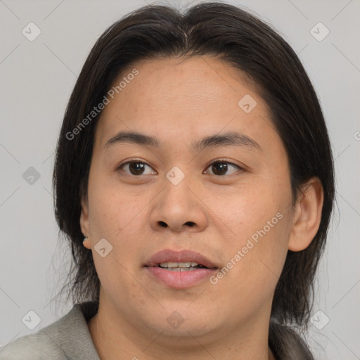 Joyful asian young-adult female with medium  brown hair and brown eyes