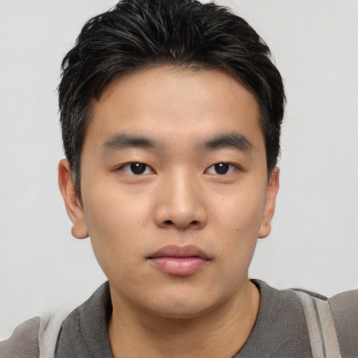 Neutral asian young-adult male with short  black hair and brown eyes