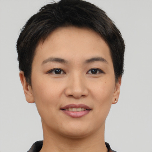 Joyful asian young-adult female with short  brown hair and brown eyes
