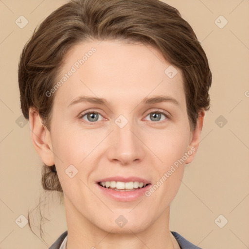 Joyful white young-adult female with short  brown hair and grey eyes