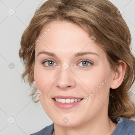 Joyful white young-adult female with medium  brown hair and blue eyes